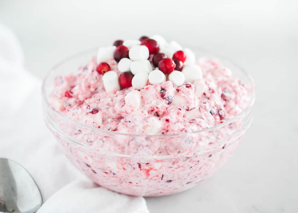 Cranberry fluff salad in a glass bowl.