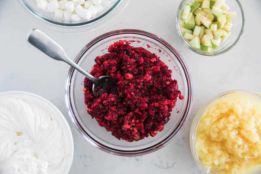 Cranberry salad ingredients in bowls.