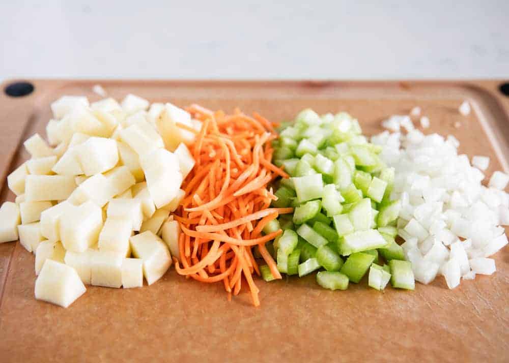 Chopped vegetables on cutting board.