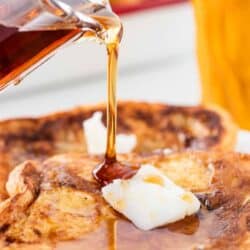 pouring syrup on top of eggnog french toast