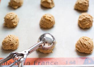 cookie dough balls on baking sheet
