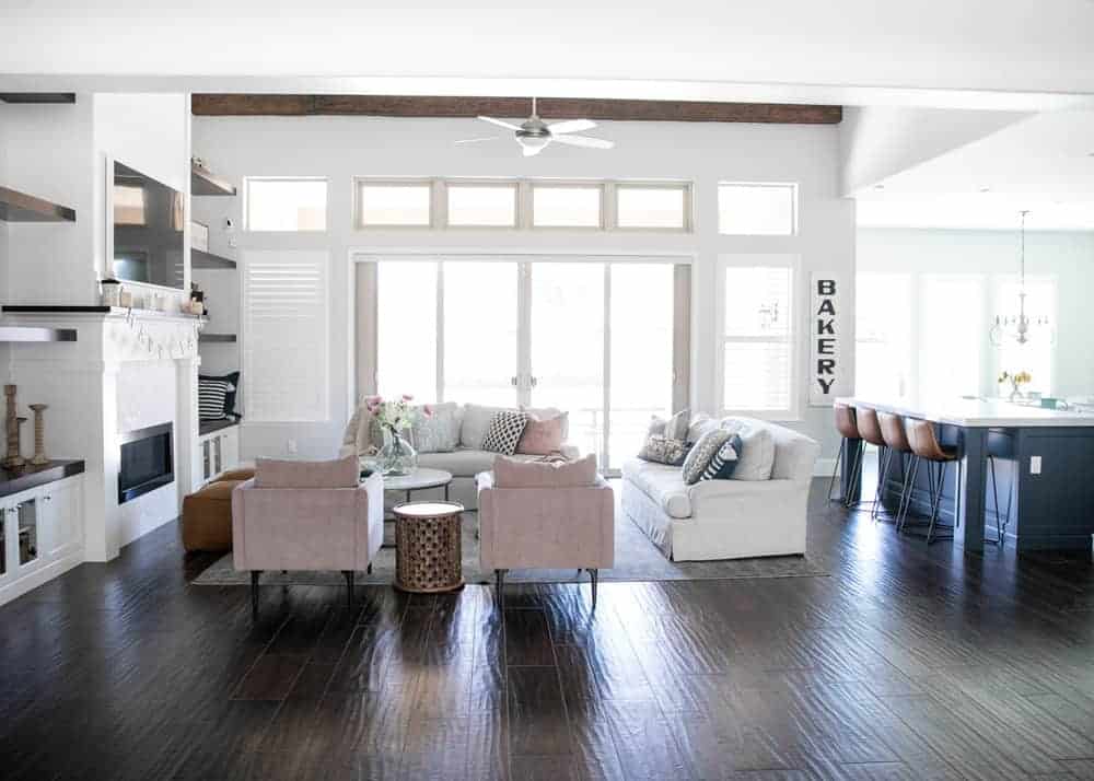 A living room filled with furniture and a wood floor