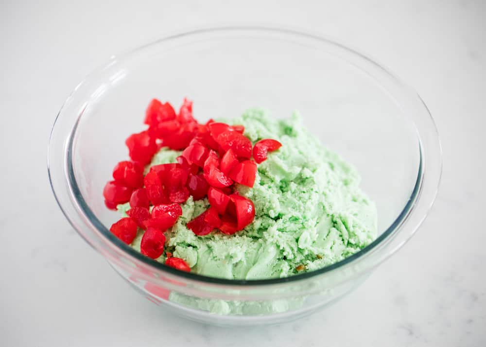 Pistachio cookie dough with chopped maraschino cherries.