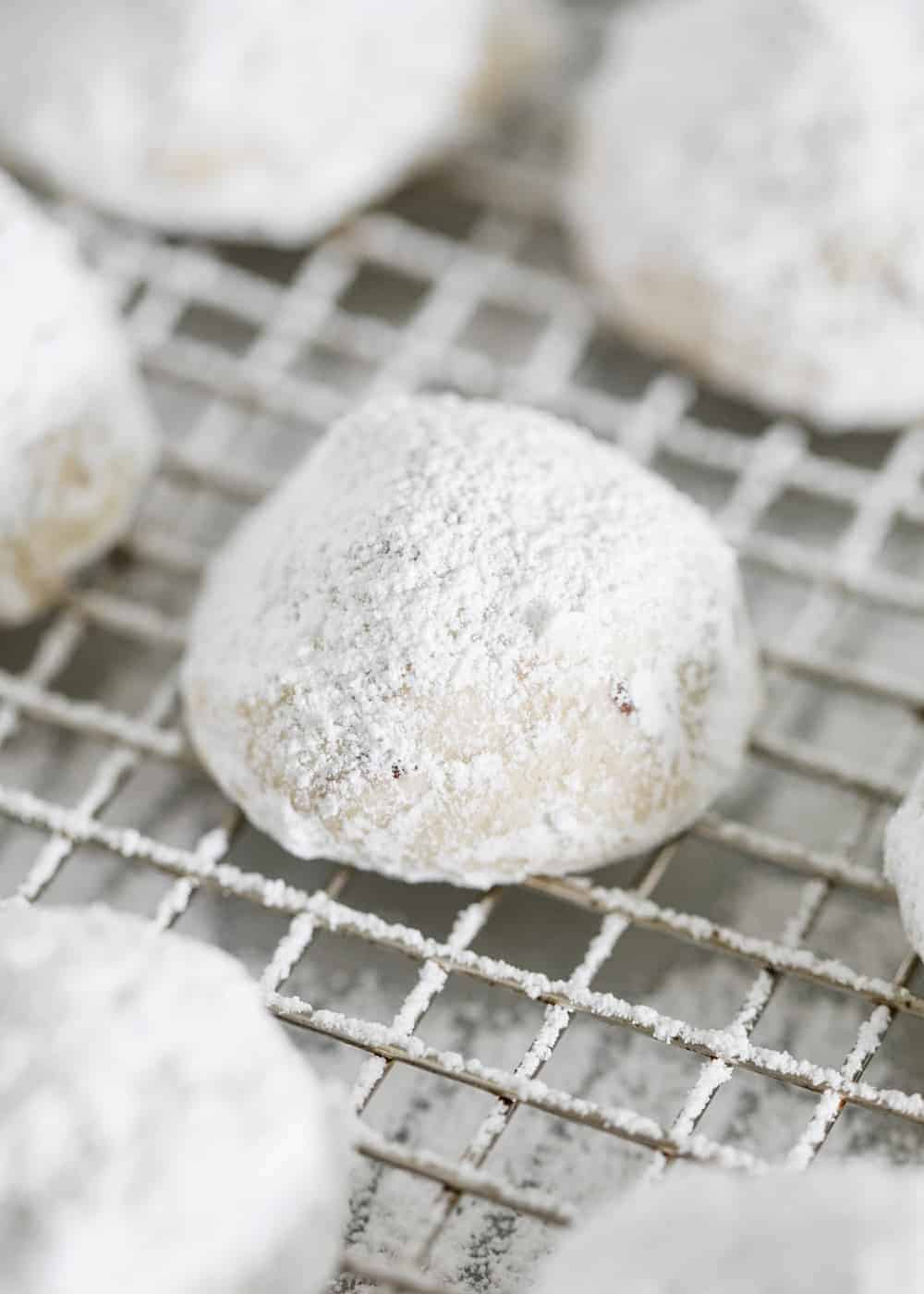 Snowball cookies on cooling rack.