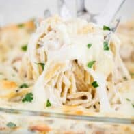 turkey tetrazzini being scooped out of dish