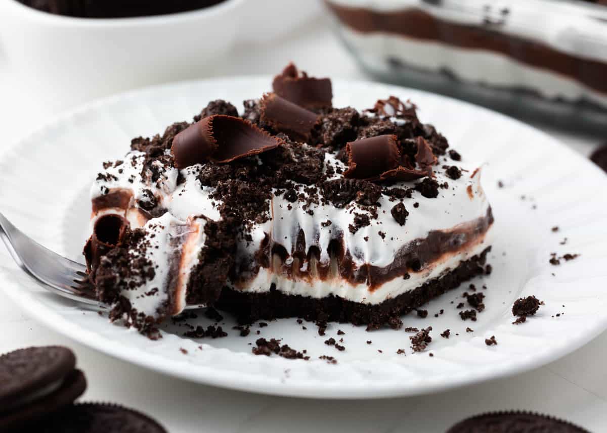 Chocolate lasagna on a white plate. 