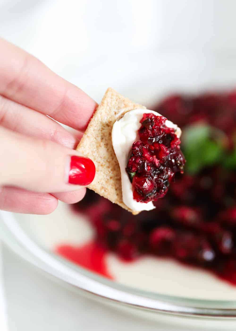 Cranberry cream cheese dip on crackers.