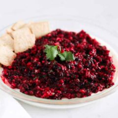 cranberry salsa in glass dish with crackers