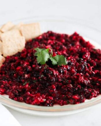 cranberry salsa in glass dish with crackers