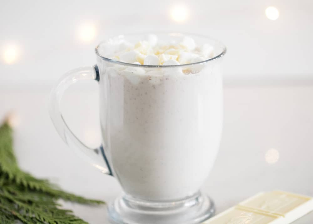 This snickerdoodle hot chocolate is a delicious twist on your standard hot chocolate, spiced with cinnamon sugar and perfect for the holiday season! Mug full of snickerdoodle hot chocolate.