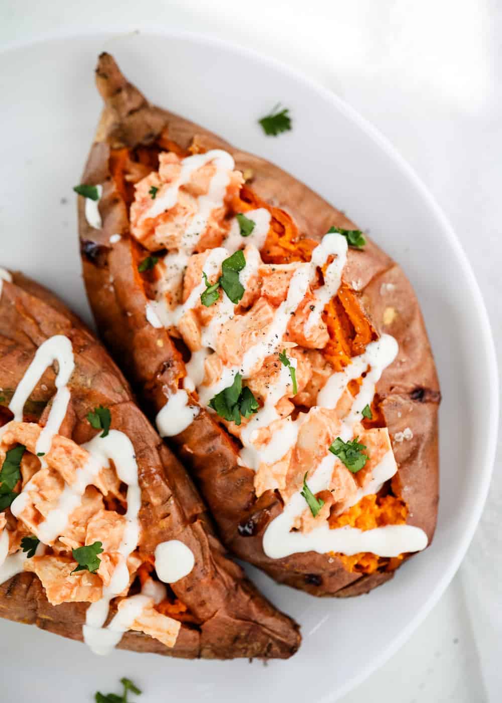 Buffalo chicken stuffed sweet potato with ranch.