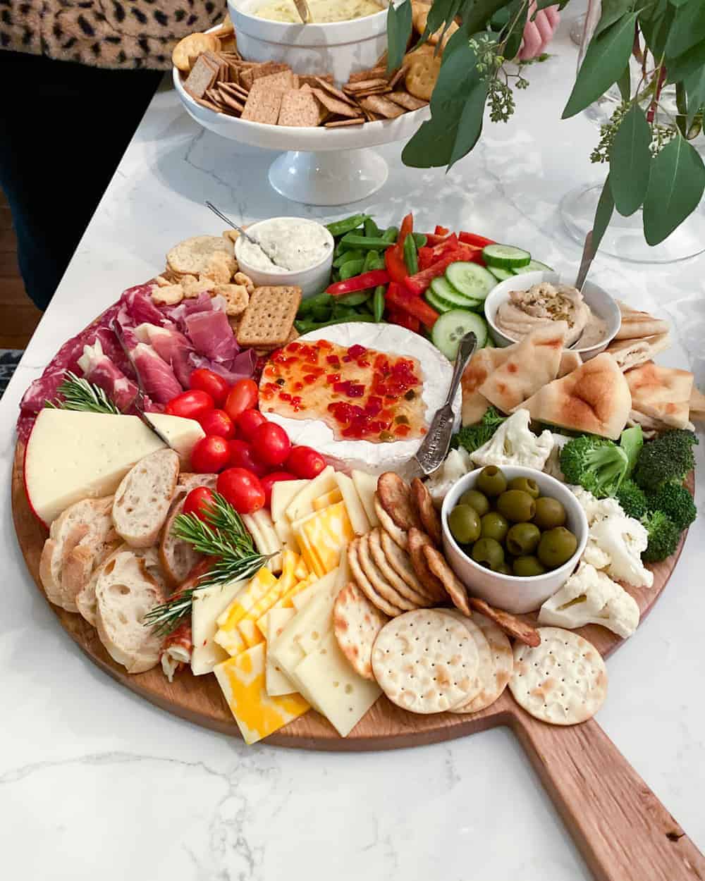 big charcuterie board with veggies, meats, cheeses and more 