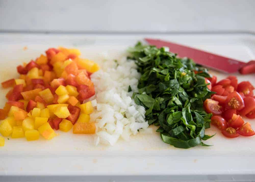 Chopped veggies on a cutting board.