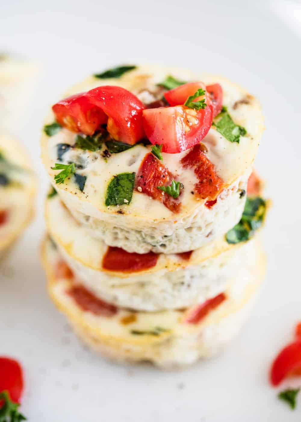 Egg white muffins with tomatoes on top.
