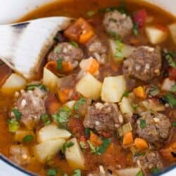 mexican meatball soup in white pot
