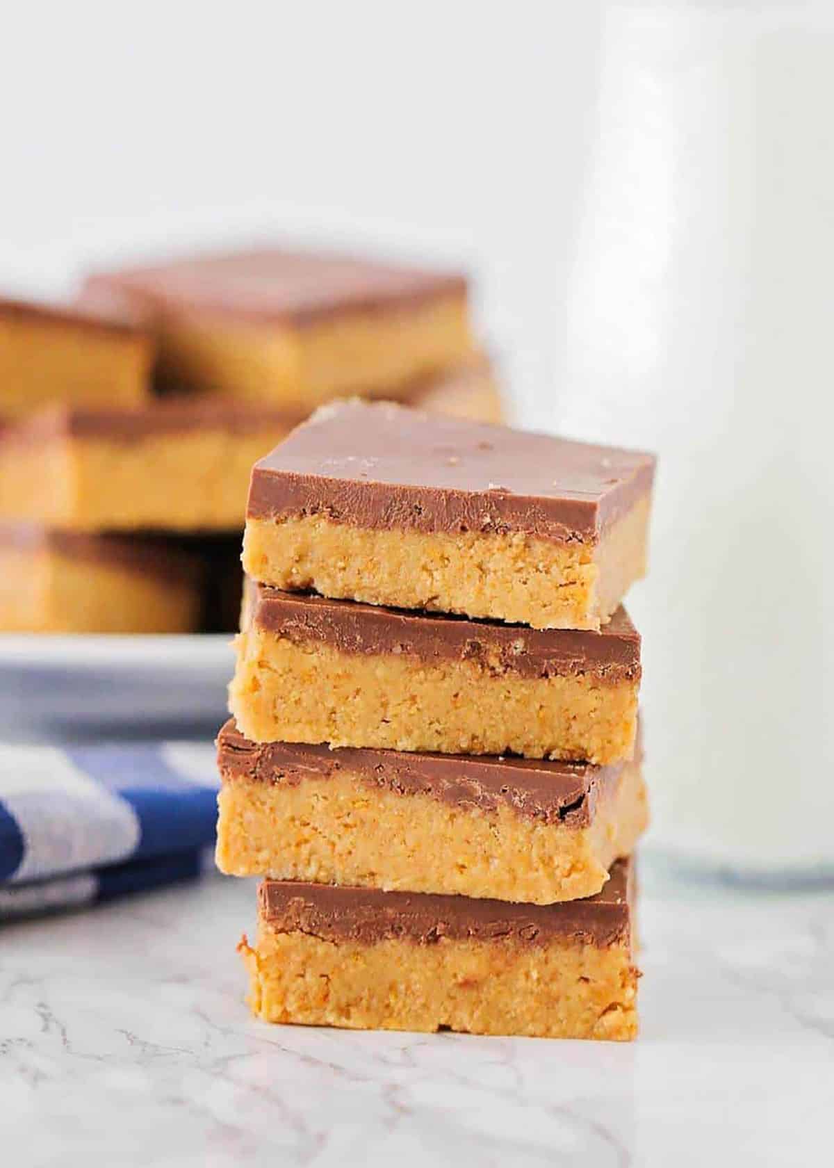 A stack of no bake peanut butter bars recipe.