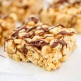 peanut butter cheerio bar with chocolate drizzled on top