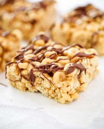 peanut butter cheerio bar with chocolate drizzled on top