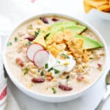 Crockpot white chicken chili served in a white bowl.