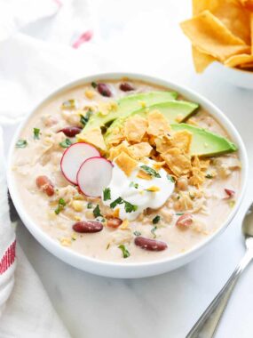 Crockpot white chicken chili served in a white bowl.