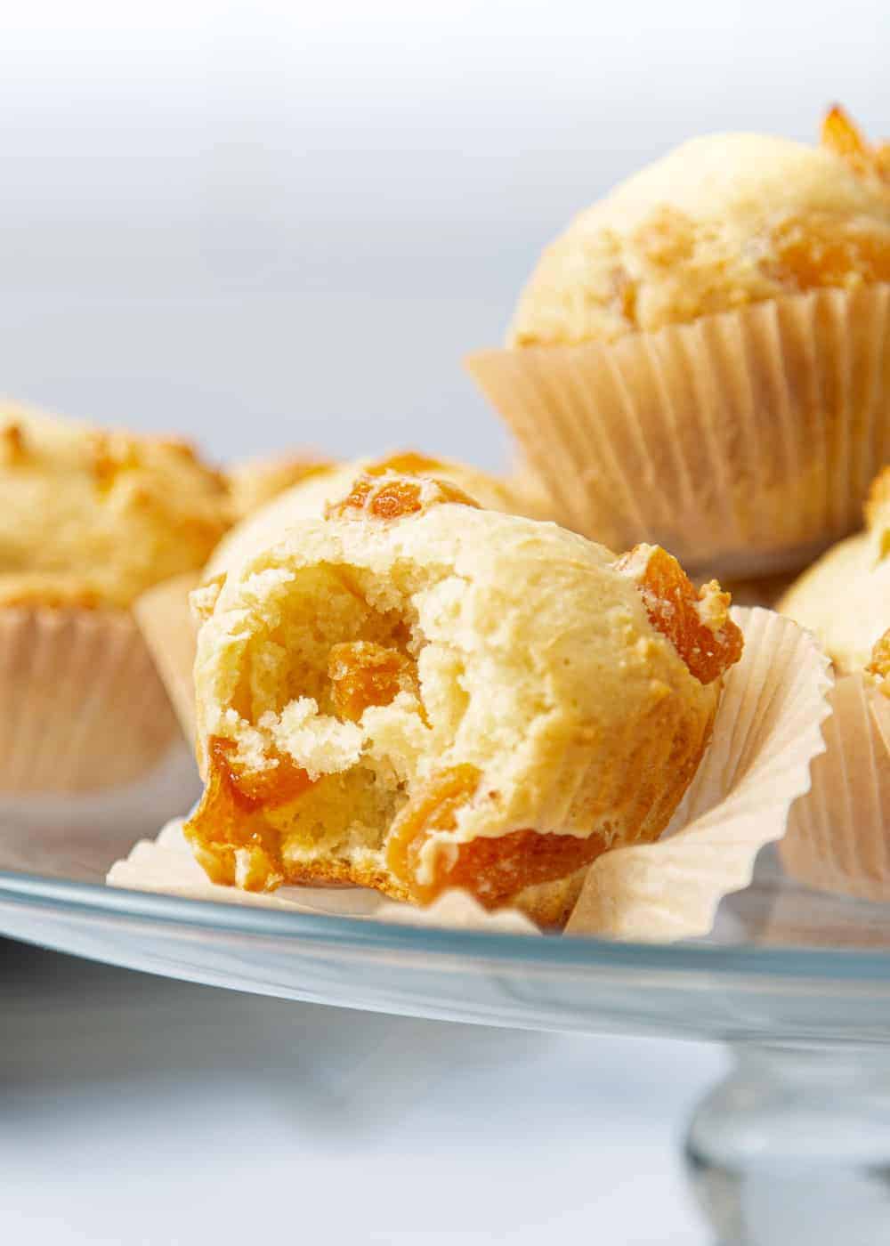 Apricot muffin with a bite taken out.