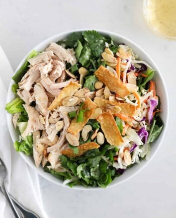 asian chicken salad in white bowl