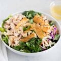 asian chicken salad in a white bowl