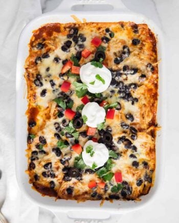 chicken enchilada casserole in white dish