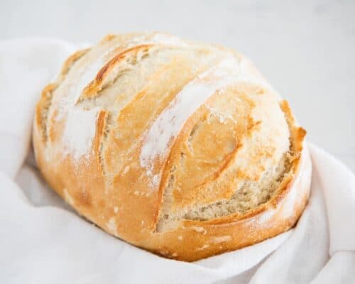 artisan bread in white towel