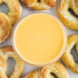 cheese dip for pretzels in glass bowl