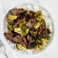 beef and broccoli in white bowl