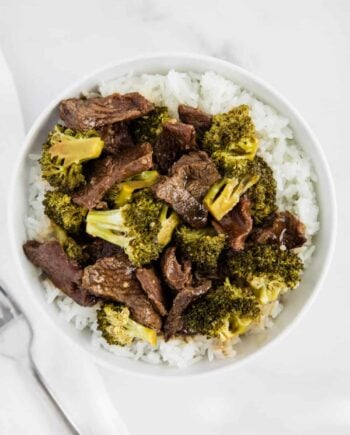 beef and broccoli in white bowl