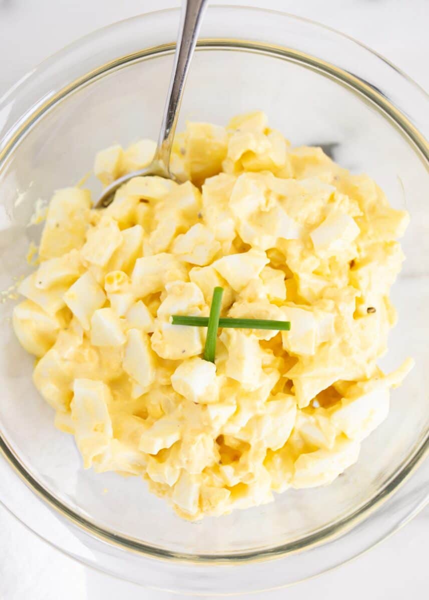 This easy egg salad recipe requires only 4 simple ingredients and takes just 10 minutes to make. It's a quick and flavorful dish that's perfect for lunch or dinner. Egg salad in a bowl.