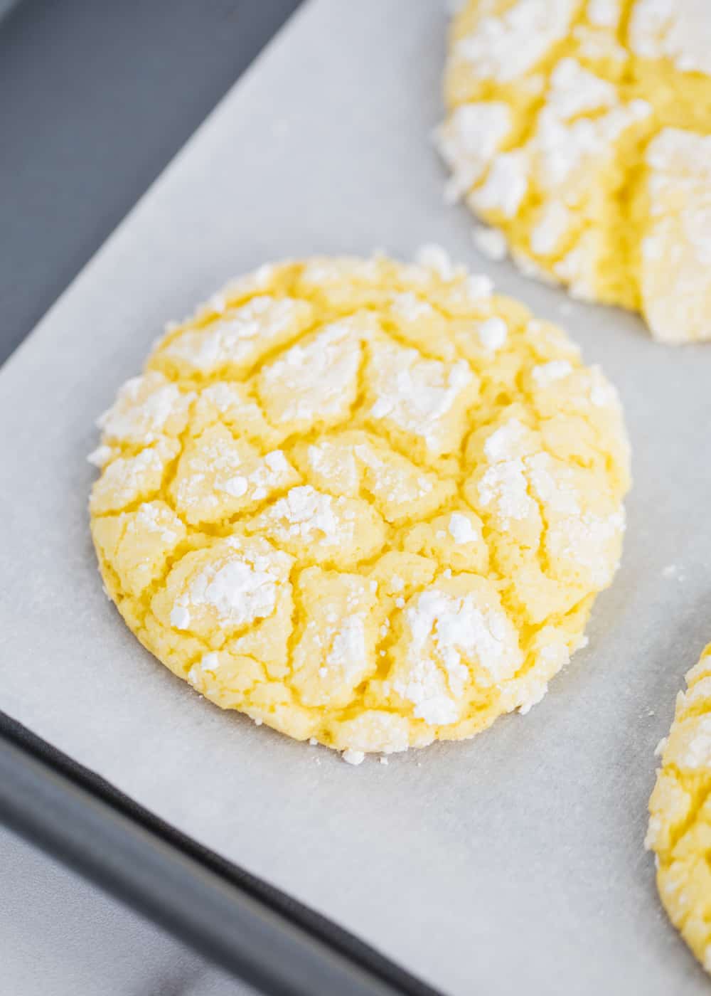 Lemon cake mix cookies on pan.