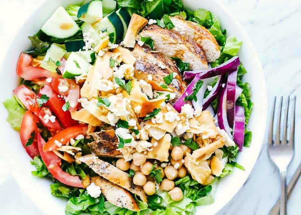 Mediterranean salad in white bowl.