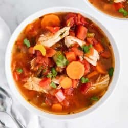 Mexican chicken soup in white bowl