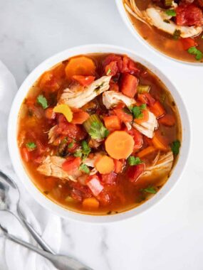 Mexican chicken soup in white bowl