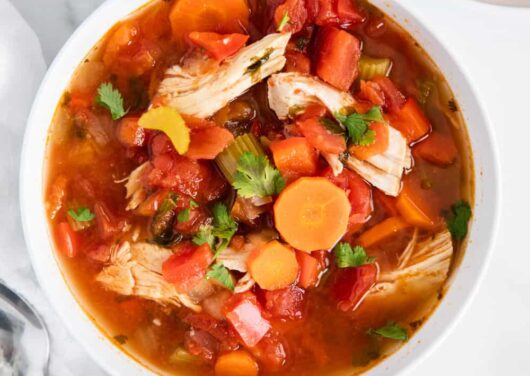 Mexican chicken soup in white bowl