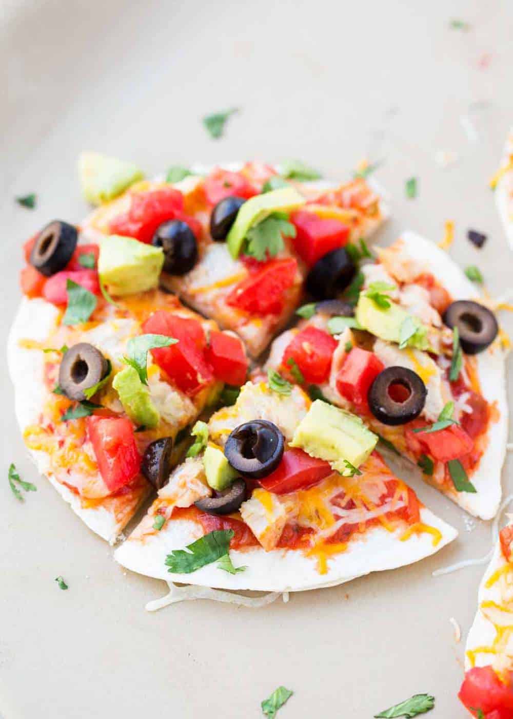 Sliced Mexican pizza with toppings.