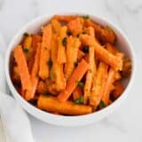 parmesan roasted carrots in white bowl