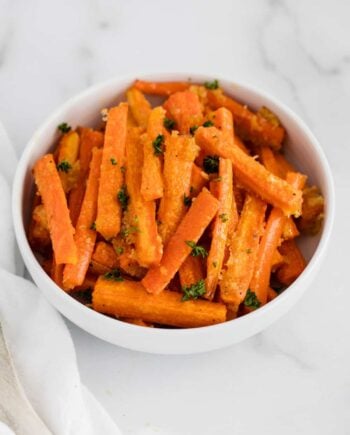 parmesan roasted carrots in white bowl