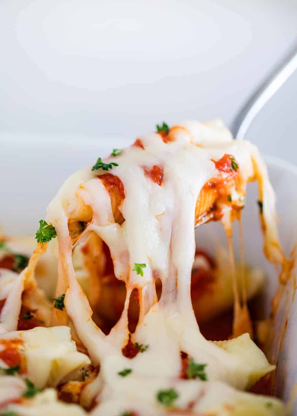 Stuffed shells on spoon.