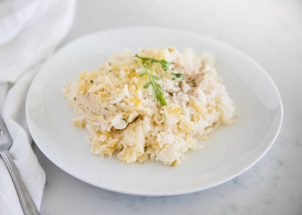 Chicken and rice casserole on white plate.