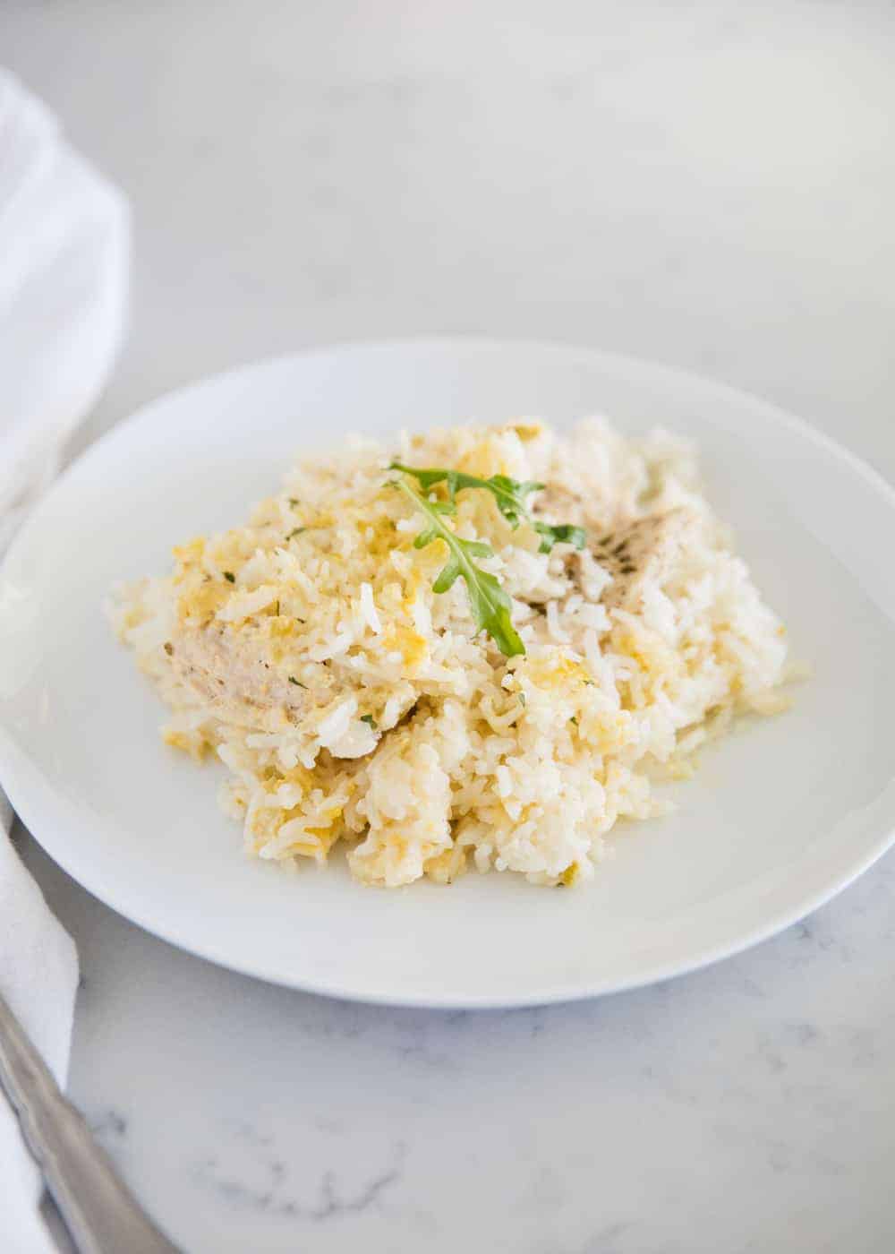 Chicken rice casserole on white plate.