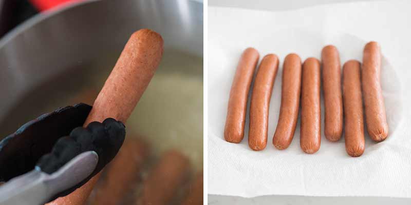 Hot dogs lined on a paper towel lined plate.