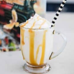 butter beer in a glass mug with a striped straw