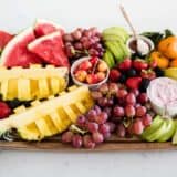 fresh fruit platter on wood board