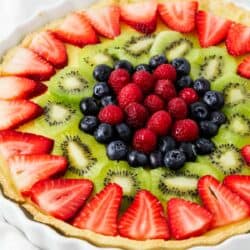 Fruit tart in a white dish.