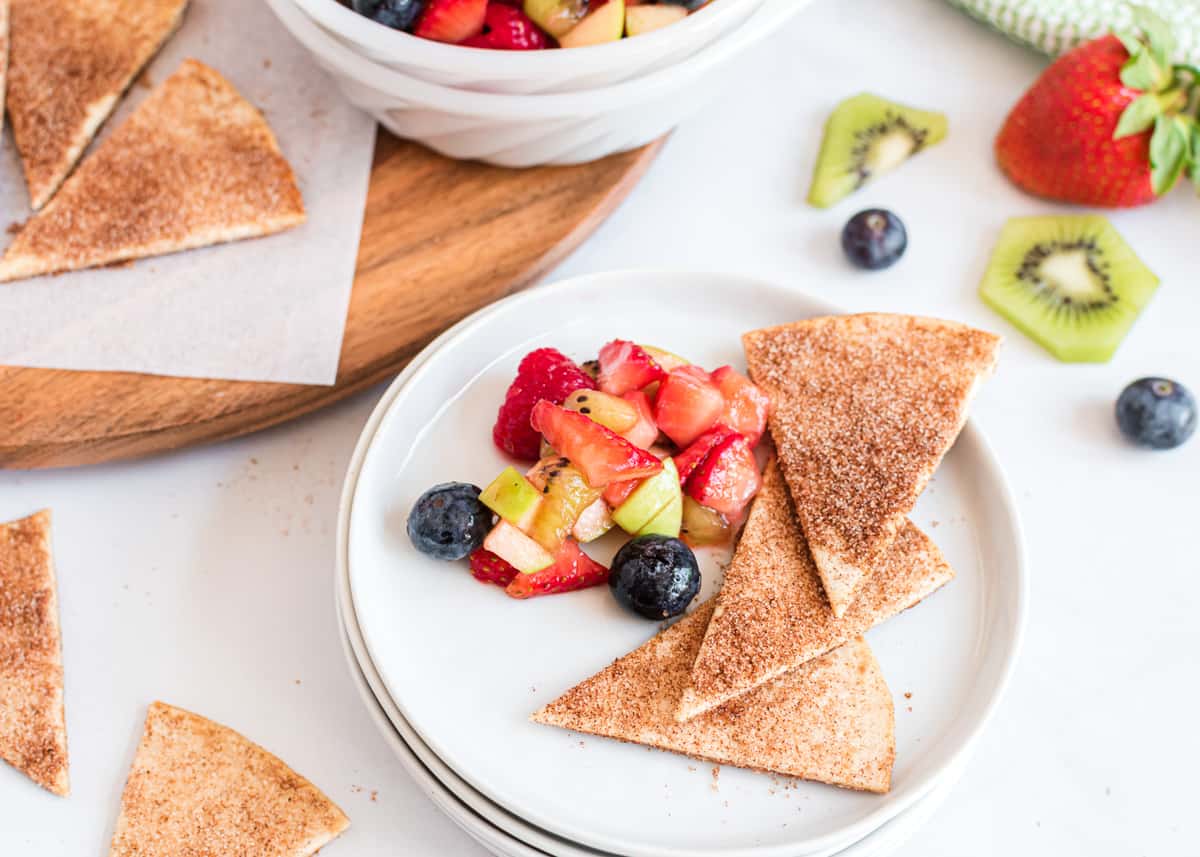 Cinnamon chips on plate with fruit.