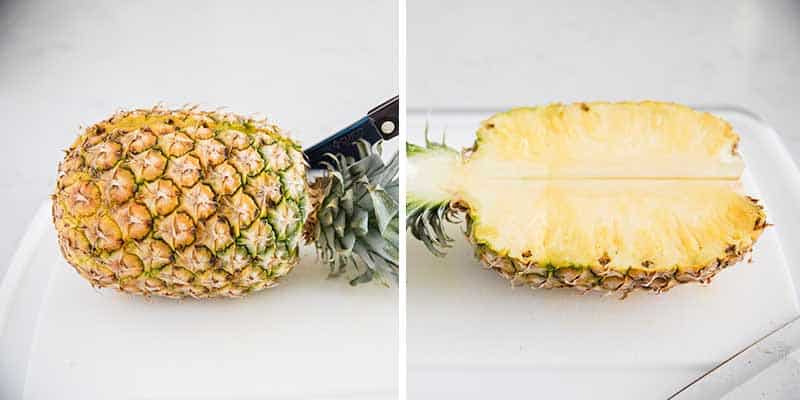 Cutting a pineapple in half.